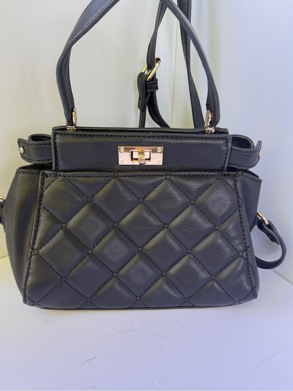 Grossi black quilted mini top-handle crossbody bag, Gold turn-lock closure